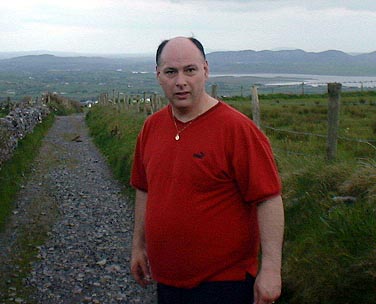 Chris Ridley climbing the lower slopes of Knocknarea mountain