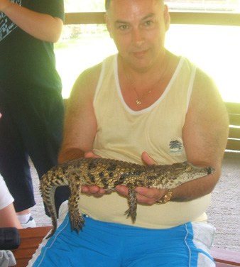 Chris Ridley holding a baby crocodile